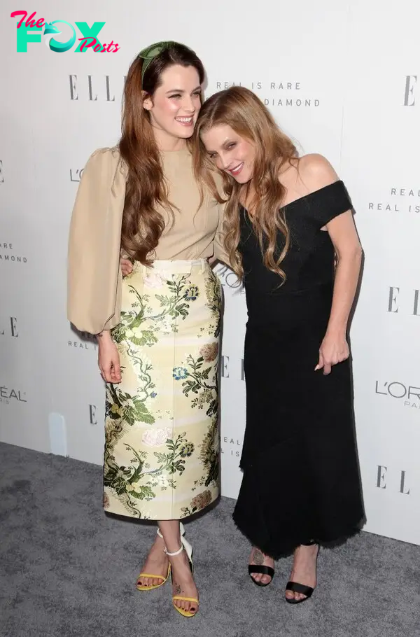 Riley Keough cuddles Lisa Marie Presley at an Elle magazine event in 2017.