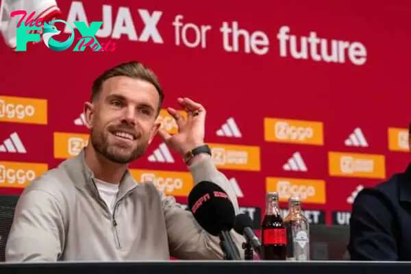 Jordan Henderson (left) and Ajax coach John van‘t Schip pictured during a press conference in Amsterdam (Peter Dejong/AP)