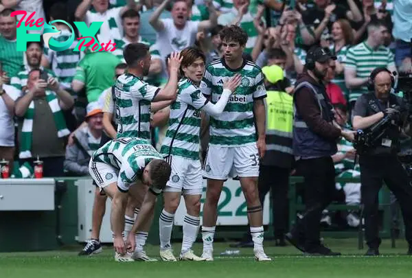 Matt O'Riley of Celtic celebrates scoring his team's first goal with teammates during the Cinch Scottish Premiership match between Celtic FC and Ra...