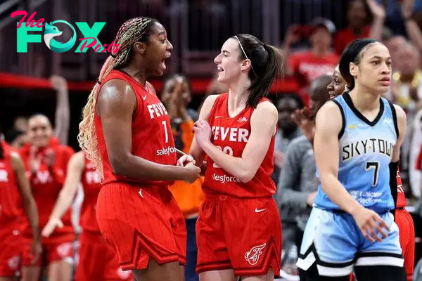 Aliyah Boston #7 and Caitlin Clark #22 of the Indiana Fever celebrate after defeating the Chicago Sky in the game at Gainbridge Fieldhouse on June 01, 2024, in Indianapolis, Indiana.