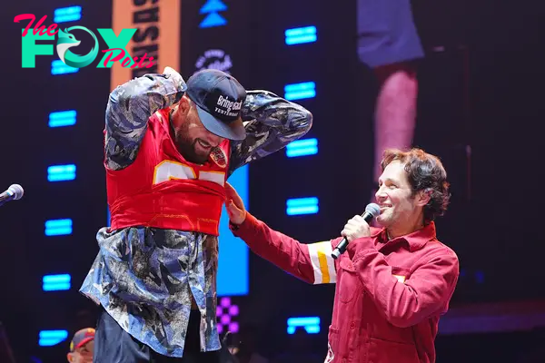 Travis Kelce and Paul Rudd on stage together