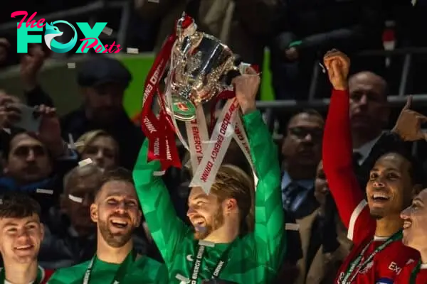 LONDON, ENGLAND - Sunday, February 25, 2024: Liverpool's goalkeeper Caoimhin Kelleher lifts the trophy after the Football League Cup Final match between Chelsea FC and Liverpool FC at Wembley Stadium. (Photo by Peter Powell/Propaganda)