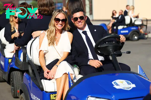 rory mcilroy and erica stoll riding in a blue golf cart