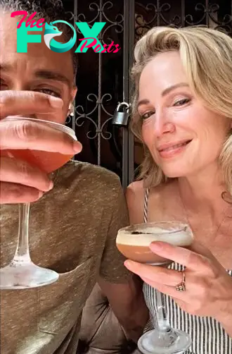 A selfie of TJ Holmes and Amy Robach drinking