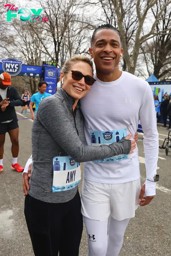 Amy Robach and TJ Holmes hugging
