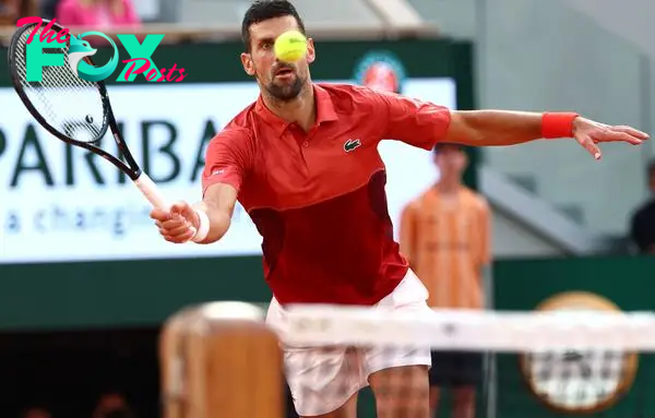 Serbia's Novak Djokovic eyes the ball during his men's singles round of sixteen match against Argentina's Francisco Cerundolo on Court Philippe-Chatrier on day nine of the French Open tennis tournament at the Roland Garros Complex in Paris on June 3, 2024
