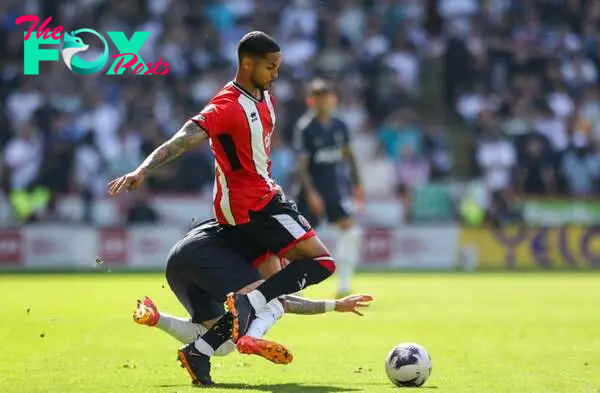 Sheffield United's Max Lowe battles with Tottenham Hotspur's James Maddison during the Premier League match between Sheffield United and Tottenham ...