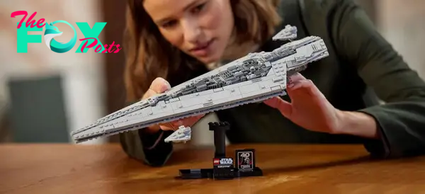 A photo of a woman holding up the Lego Executor