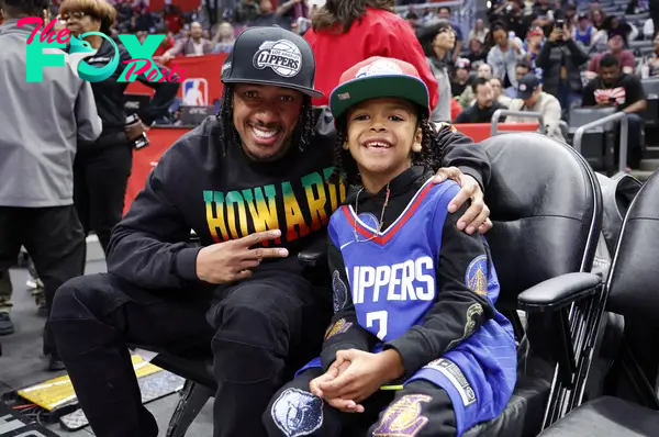 Nick Cannon and son Golden at a game.