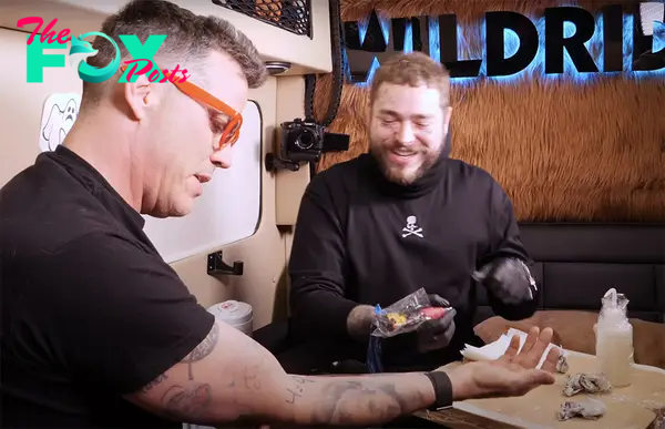 A photo of Steve-O and Post Malone tattooing each other