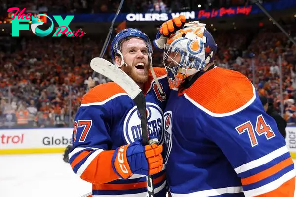  Connor McDavid #97 and Stuart Skinner #74 of the Edmonton Oilers celebrate after beating the Dallas Stars