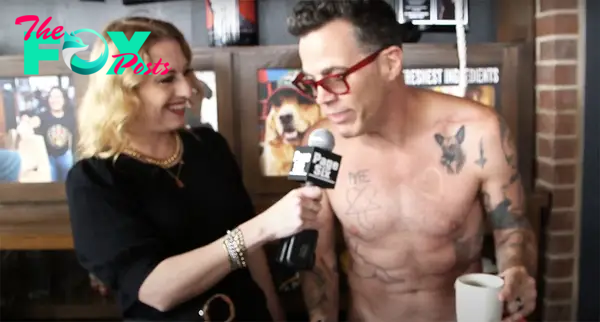 A photo of Page Six reporter Desiree Murphy interviewing “Jackass” star Steve-O about his tattoo from Post Malone at Rock & Brews