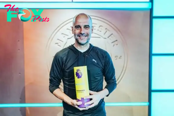 MANCHESTER, ENGLAND - Tuesday, May 21, 2024: Manchester City's manager Josep 'Pep' Guardiola with the Premier League Manager of the Season Award. (Photo by Manchester City FC)