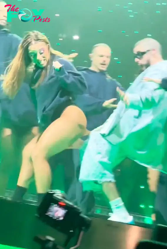 Bad Bunny performing with a dancer.