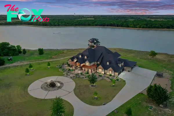 430 Chaparall Road Home in Ferris, Texas. Discover this breathtaking custom lake home nestled on 514 secluded acres, just 15 minutes south of Dallas. Meticulously constructed with stunning lake views from every room, this home features vaulted ceilings, a chef's dream kitchen, luxurious owner's suite, formal dining, study, and more. 