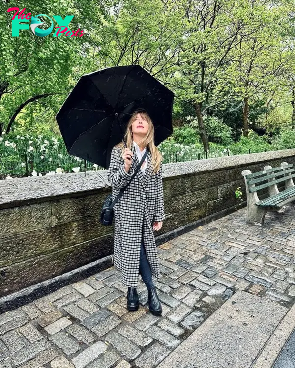 Julianne Hough holding an umbrella.