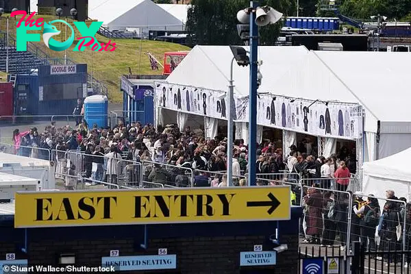 Fans queue for Taylor Swift merchandise outside the Murrayfield Stadium today