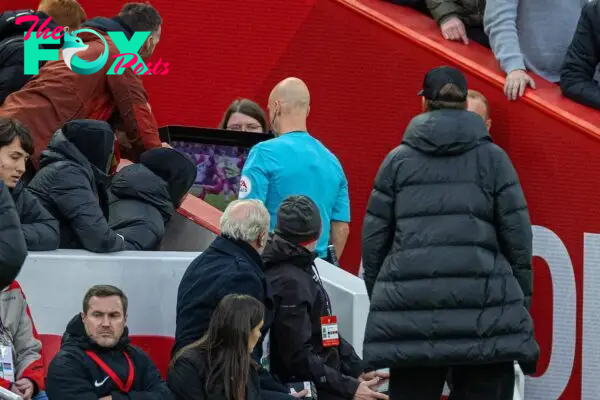 LIVERPOOL, ENGLAND - Sunday, October 16, 2022: Referee Anthony Taylor indicates a VAR review during the FA Premier League match between Liverpool FC and Manchester City FC at Anfield. (Pic by David Rawcliffe/Propaganda)