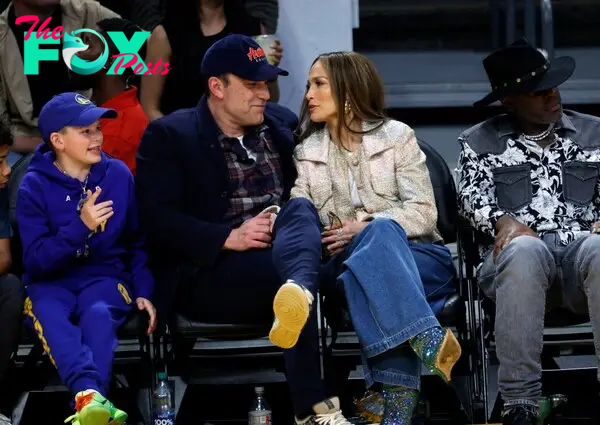 Jennifer Lopez, Ben Affleck and Samuel Garner at an NBA game.