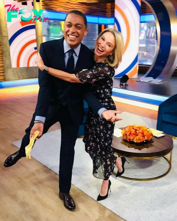 TJ Holmes and Amy Robach hugging