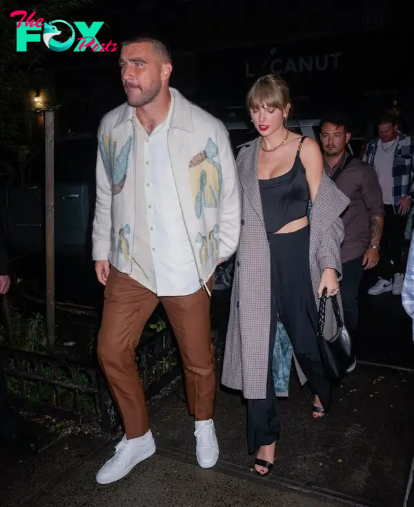 Travis Kelce and Taylor Swift hold hands