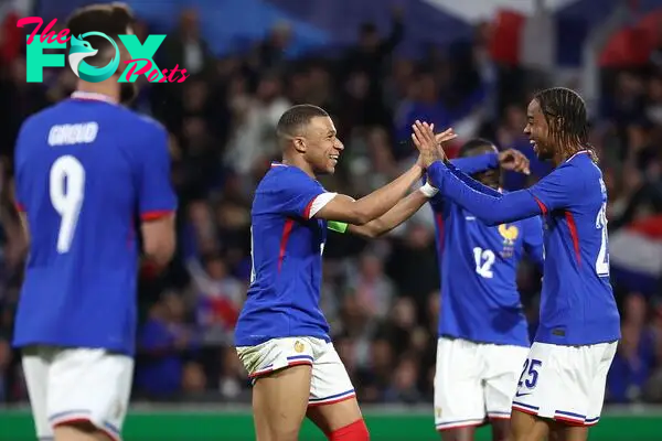 France's forward #10 Kylian Mbappe (C) celebrates with France's forward #25 Bradley Barcola