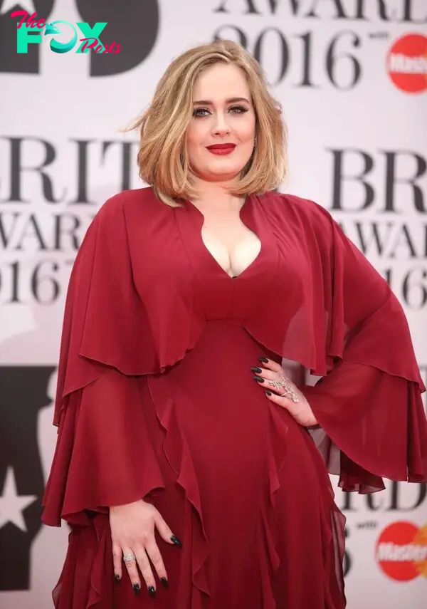 Adele wearing a red dress