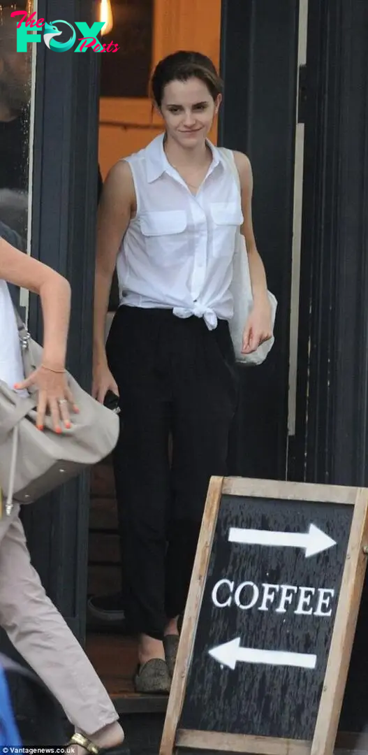 Summer ready: Emma Watson nails the off-duty look as she steps out with barely-there make-up and her hair swept into an updo