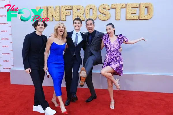 Jerry and Jessica Seinfeld with their kids Julian, Shepard, and Sascha on a red carpet. 