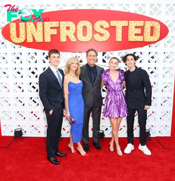 Jerry and Jessica Seinfeld with their kids Julian, Shepard, and Sascha on a red carpet. 