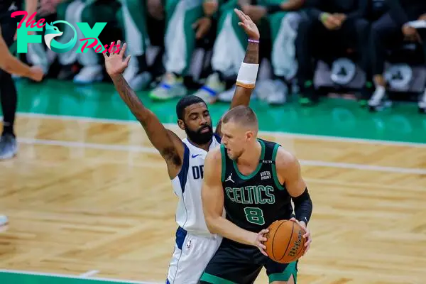 Boston Celtics center Kristaps Porzingis (R) of Latvia in acton against Dallas Mavericks 