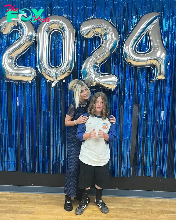 Tori Spelling and her son Finn posing at his graduation