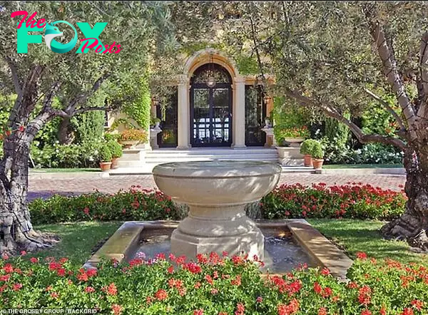 Leafy: A stone fountain sits adjacent to the property, which is surrounded Ƅy Ƅeautifully tended gardens