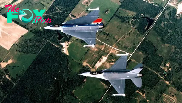 An air-to-air top left view of an F-16XL prototype and the F-16 Fighting Falcon aircraft