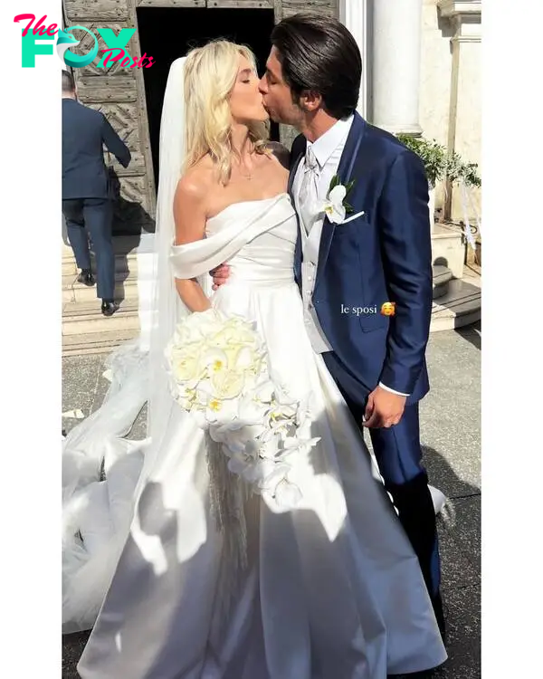 Andrea Denver and Lexi Sundin kissing on their wedding day