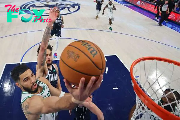 Jun 12, 2024; Dallas, Texas, USA; Boston Celtics forward Jayson Tatum (0) shoots the ball against Dallas Mavericks center Dereck Lively II (2) during the second quarter during game three of the 2024 NBA Finals at American Airlines Center. Mandatory Credit: Stacy Revere/Pool Photo-USA TODAY Sports