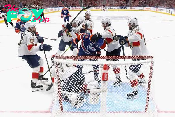 EDMONTON, CANADA - JUNE 13: The Florida Panthers combine on Adam Henrique #19 of the Edmonton Oilers during the third period of Game Three of the 2024 Stanley Cup Final at Rogers Place on June 13, 2024 in Edmonton, Alberta, Canada.   Bruce Bennett/Getty Images/AFP (Photo by BRUCE BENNETT / GETTY IMAGES NORTH AMERICA / Getty Images via AFP)