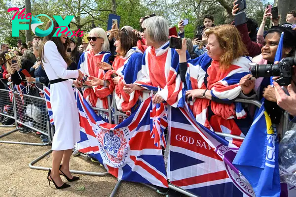 Catherine, Princess of Wales, meets well-wishers during a walkabout on the Mall outside Buckingham Palace ahead of the coronation of Britain's King Charles and Camilla, Queen Consorton May 5, 2023 in London, England. 