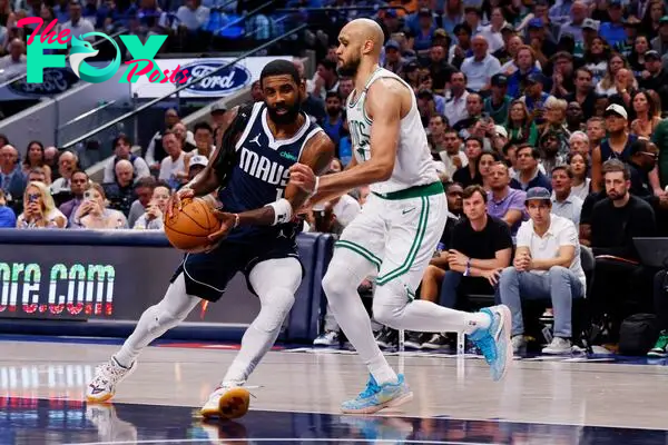 Jun 14, 2024; Dallas, Texas, USA; Dallas Mavericks guard Kyrie Irving (11) drives to the basket against Boston Celtics guard Derrick White (9) during the third quarter during game four of the 2024 NBA Finals at American Airlines Center. Mandatory Credit: Peter Casey-USA TODAY Sports