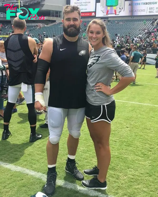 Jason and Kylie Kelce on the football field. 