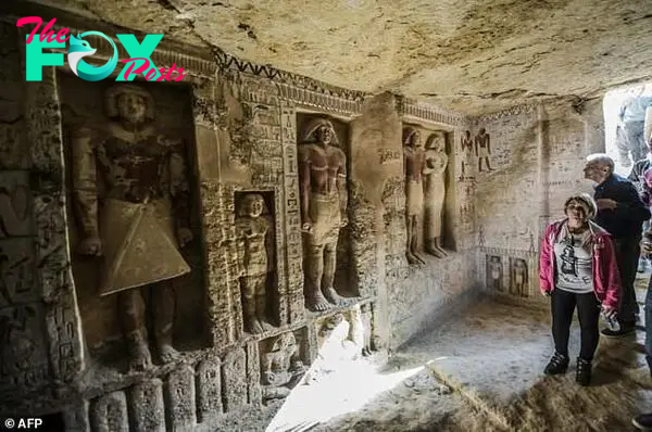 Guests enter a newly-discovered tomb at the Saqqara necropolis, 30 kilometres south of Cairo, belonging to the high priest "Wahtye" who served during the reign of King Neferirkare