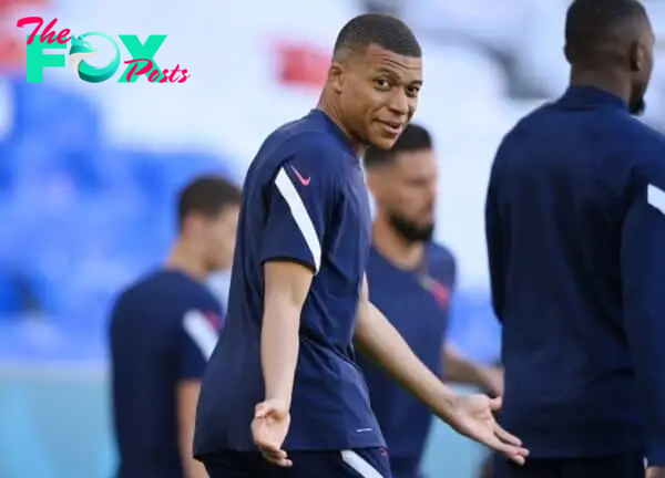 MUNICH, GERMANY - JUNE 14: Kylian Mbappe of France reacts during the France Training Session ahead of the Euro 2020 Group match between France and Germany at Fussball Arena Muenchen on June 14, 2021 in Munich, Germany. (Photo by Sebastian Widmann - UEFA/UEFA via Getty Images)