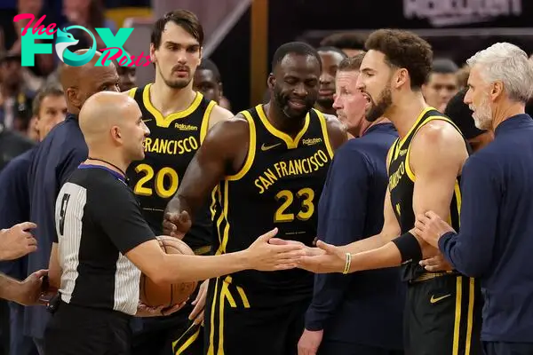 Klay Thompson #11 and Draymond Green #23 of the Golden State Warriors complain to the referee after getting into an altercation with the Minnesota Timberwolves at Chase Center on November 14, 2023 in San Francisco, California.