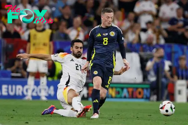 Ilkay Gundogan of Germany and Callum McGregor of Scotland challenge during the UEFA EURO 2024 group stage match between Germany and Scotland at Mun...