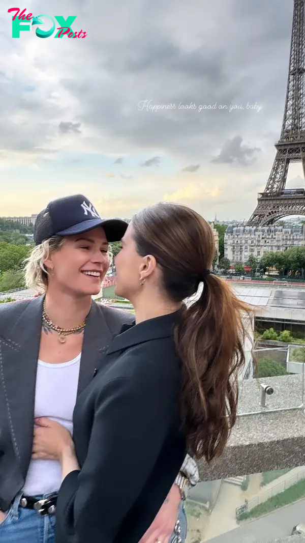 ashlyn harris and sophia bush kissing in front of eiffel tower