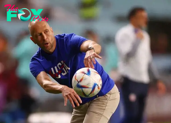 U.S. coach Gregg Berhalter throws a ball