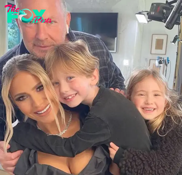 Dorit and PK Kemsley sitting with their kids