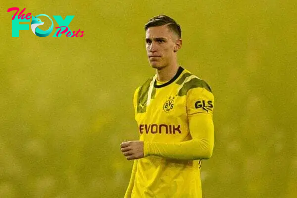 LONDON, ENGLAND - Tuesday, March 7, 2023: Borussia Dortmund's Nico Schlotterbeck, almost lost in the yellow smoke, during the UEFA Champions League Round of 16 2nd Leg game between Chelsea FC and Borussia Dortmund at Stamford Bridge. Chelsea won 2-0, 2-1 on aggregate. (Pic by David Rawcliffe/Propaganda)