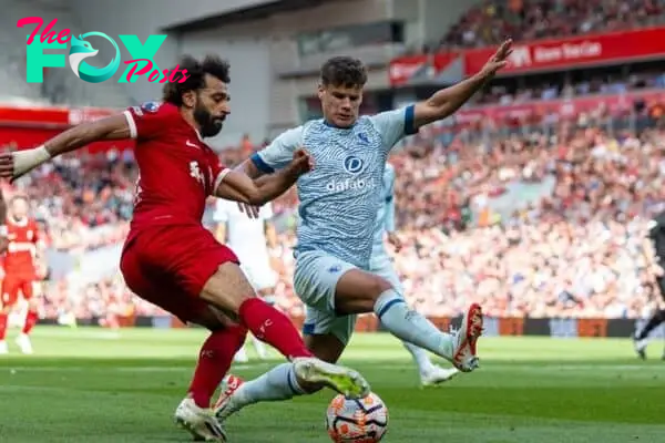 LIVERPOOL, ENGLAND - Saturday, August 19, 2023: Liverpool's Mohamed Salah (L) gets past Bournemouth's Milos Kerkez during the FA Premier League match between Liverpool FC and AFC Bournemouth at Anfield. Liverpool won 3-1. (Pic by David Rawcliffe/Propaganda)