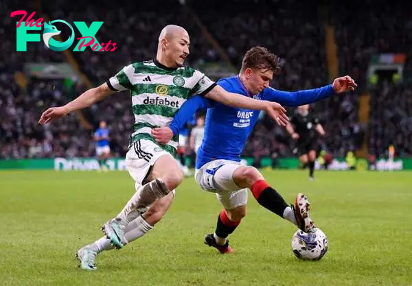 Ridvan Yilmaz of Rangers on the ball whilst under pressure from Daizen Maeda of Celtic during the Cinch Scottish Premiership match between Celtic F...